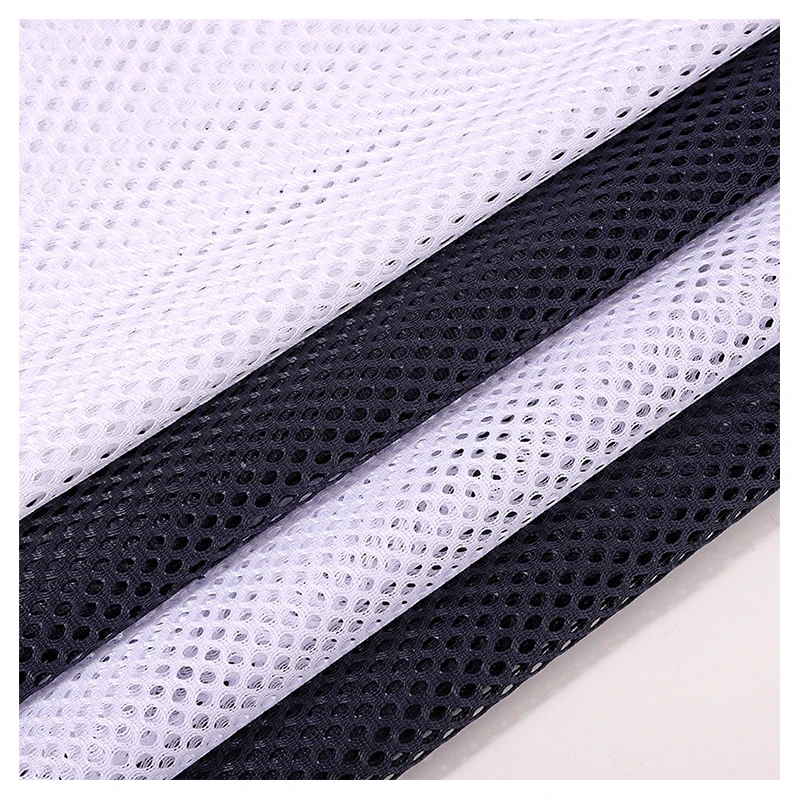 Stock Lot Wholesale Price 250gsm Soft 100%Polyester Tricot Knitted Hexagonal Mesh Fabric for Sports Wear Bags Office Chair