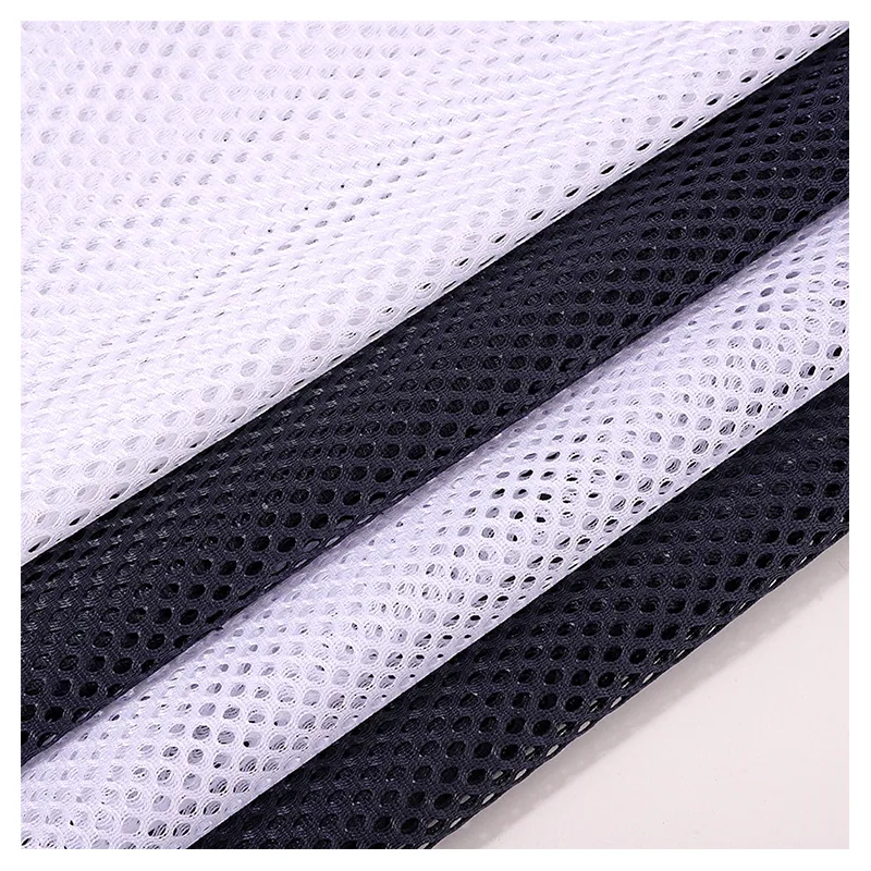 Stock Lot Wholesale Price 250gsm Soft 100%Polyester Tricot Knitted Hexagonal Mesh Fabric for Sports Wear Bags Office Chair