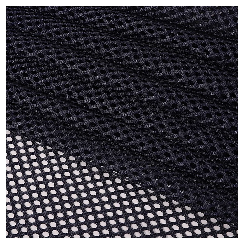 Stock Lot Wholesale Price 250gsm Soft 100%Polyester Tricot Knitted Hexagonal Mesh Fabric for Sports Wear Bags Office Chair