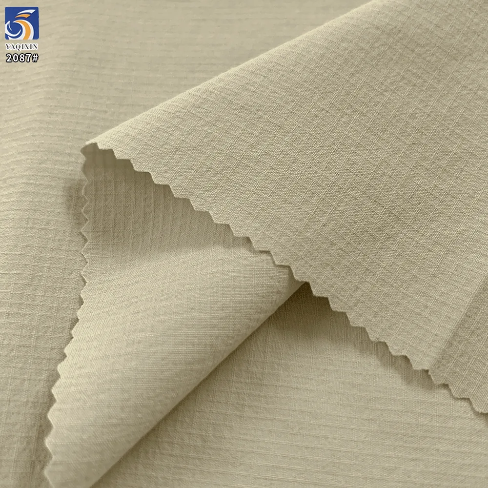 YX2087 110gsm Lightweight 88% Nylon 12% Spandex Jacquard Grid Fabric 4 Way Stretch for Hiking Jackets and Sportswear