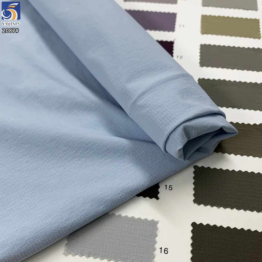 YX2087 110gsm Lightweight 88% Nylon 12% Spandex Jacquard Grid Fabric 4 Way Stretch for Hiking Jackets and Sportswear